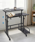 Smooth Operator Height Adjustable Standing Desk With Heavy Duty Steel Build And Six Easy Roll Wheels For Ergonomic Sit Stand Office Setup To Level Up Your Grind, showcasing adjustable height with books.