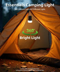 Rechargeable LED Camping Lantern With 6000mAh Battery Emergency Outdoor Tent Light illuminating inside of an orange tent.