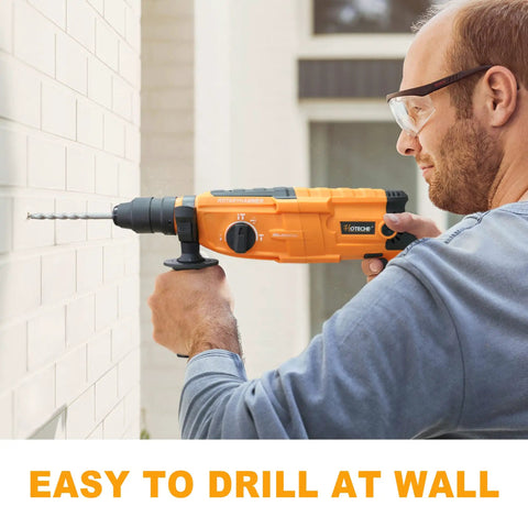 Person using 3 In 1 Rotary Hammer Drill With SDS Plus 1 Inch Chuck 800 Watt Corded Demolition Hammer For Concrete Variable Speed on brick wall