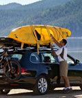 Heavy Duty Four Pack 2 Inch Ratchet Straps With Reinforced Barrels And Double J Hooks For Bulletproof Cargo Tie Downs on kayak atop a black car.