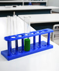 Blue six tube test tube stand made from durable polypropylene with 25mm diameter holes, autoclavable for sterilizing, includes six drying pins