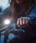 Cyclist with Two Pack 1500LM USB Rechargeable Bike Lights Set Front Headlight And Tail Light Waterproof With 5 Modes Fits Road And Mountain Bikes