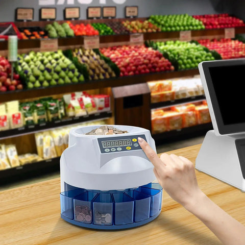 Person using Eight Slot Coin Sorter and Counter with eight bins on a wooden counter in a grocery shop setting.