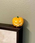 Pumpkin figurine as part of Spooky Season Hinge Head Figurine Set for Halloween Decor Magnetic Miniature Bat Pin Topper for Doors and Home Office with Whimsical Personality by UKNRW.