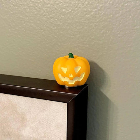 Pumpkin figurine as part of Spooky Season Hinge Head Figurine Set for Halloween Decor Magnetic Miniature Bat Pin Topper for Doors and Home Office with Whimsical Personality by UKNRW.