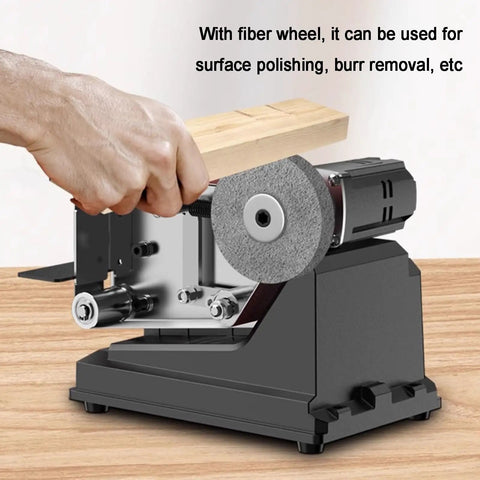 Hand using Tailgate Ready Belt Sander And Bench Grinder Duo with fiber wheel for polishing, 7000 RPM motor.