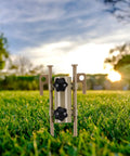 Beefy Adjustable Tent Stake Hammer Set With Aluminum Poles And Sand Stakes on green grass in a sunny outdoor setting