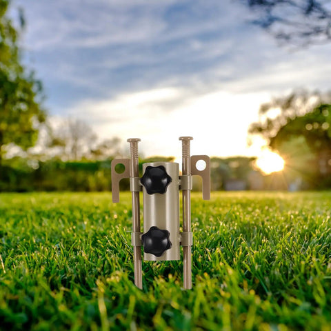 Beefy Adjustable Tent Stake Hammer Set With Aluminum Poles And Sand Stakes on green grass in a sunny outdoor setting