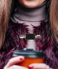 No Sweat Adjustable Spring Loaded Back Cincher Clips For Women on a fur vest, providing smooth fit for blouses.