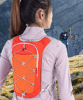 Trail Ready Hydration Vest With Adjustable Chest Straps worn by hiker outdoors, lightweight pack for running, cycling, hiking