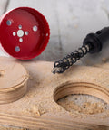 DIY Pro Grade Hole Saw Kit For Recessed And Can Lights 2, 3, 4, 6 Inch Bi Metal with cut plywood and drill bit visible