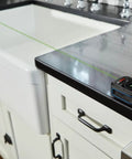 Blaze Green Beam Laser Distance Measure With 165 Foot Range And One Sixteenth Inch Accuracy on kitchen counter