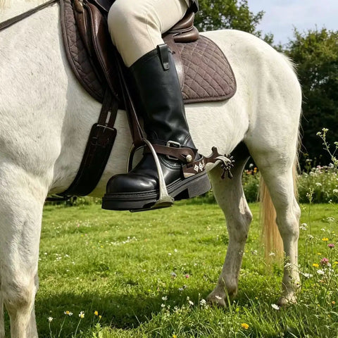 Rider wearing Old School Western Cowboy Spurs With German Silver Hand Engraved Trims on horseback, antique look, side view