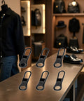 6 Pack Black Detachable Zipper Pull Replacements Kit For Jackets, Pants, Coats, Shoes, Bags And Luggage displayed on table