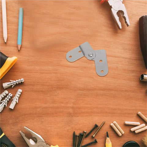 Six Piece Heavy Duty Folding Hinge Set for attic ladders and table legs on wooden surface with tools and screws visible