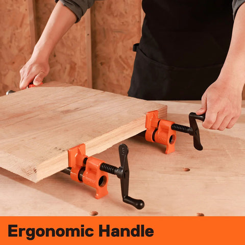 PONY 2-pack orange wood-gluing pipe clamps with black handles gripping a wooden board for 3/4 in pipe
