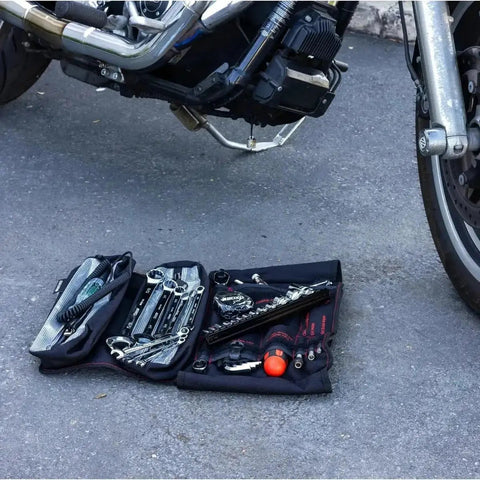 Ride Ready 48 Piece Motorcycle Tool Kit In A Compact Roll Up For Harley Davidson Indian And Other V Twin Bikes on ground near bike