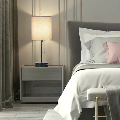 Two Pack 17.3 Inch Table Lamps With USB Ports And AC Outlet For Bedside Nightstands And Desks Or Living Rooms, Modern Gray Fabric Shade Lamps With Pull Chain Switch, totally perfect for bedroom office nursery reading, displayed on a bedside table in a modern bedroom setting