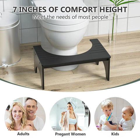 7 Inch Bamboo Toilet Stool For Adults And Kids Poop Stool For Bathroom Use Relieves Bowel Pressure Eases Defecation Anti Slip Grippy Surface Easy Clean Black placed in bathroom.