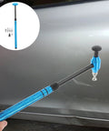 Pro Grade Multi Head Paintless Dent Removal Hammer Kit with blue handle used on car door for smooth dent repair.