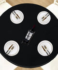 Round Fitted Tablecloth With Elastic Edge, 100 Percent Waterproof Plastic Cover, Vinyl Flannel Backed Table Protector For Indoor Outdoor Use, Snug Fit Wont Slip On 45 To 56 Inch Round Tables, Black shown with dining setup