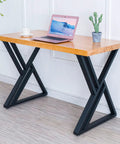 Two Pack Beefy Heavy Duty Metal Desk Legs 28 Inch High 20 Inch Wide Matte Black Wrought Iron Tubes For Modern Industrial Kitchen Office Computer Desk Table Built To Last supporting a wooden table top in an office setting.