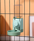 No Sweat Bird Feeder And Water Dispenser Set For Parrot Cages with green water dispenser attached to cage bars.