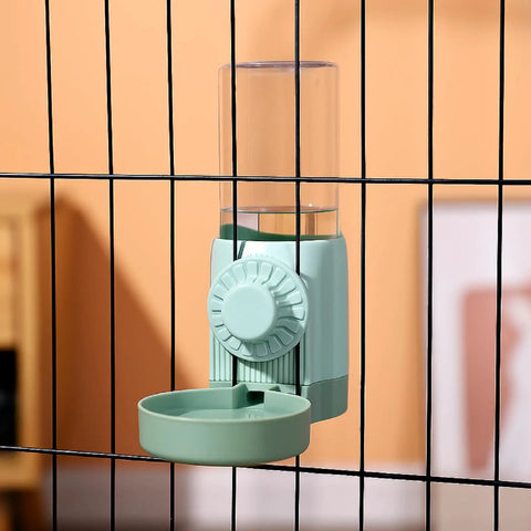 No Sweat Bird Feeder And Water Dispenser Set For Parrot Cages with green water dispenser attached to cage bars.