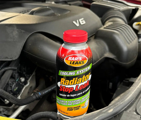 Radiator Stop Leak 11 Oz Quick Fix No Fuss For Cars Seals Internal External And Coolant To Oil Leaks With Pelletized Formula Stops Current And Future Leaks For A Stronger Cooling System bottle in car engine bay