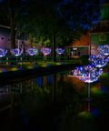 Must Have Outdoor Solar Firework Stake Lights With 120 LEDs Waterproof 2 Pack Sparklers String Lights illuminating garden