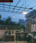 Solar Pendant Lights With Dual LED Bulbs, IP65 Waterproof Outdoor Dusk To Dawn Auto Lamp illuminating a rainy balcony
