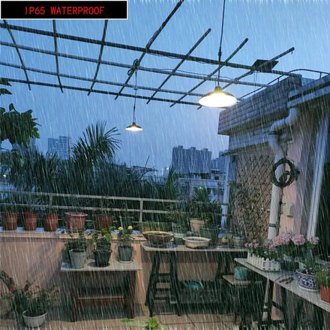 Solar Pendant Lights With Dual LED Bulbs, IP65 Waterproof Outdoor Dusk To Dawn Auto Lamp illuminating a rainy balcony