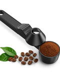 Mess Free Two Tablespoon Coffee Scoop With Built In Funnel For Reusable K Cup Pods shown with coffee beans and leaves