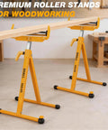 Two Pack Folding Roller Stands Built for Heavy Duty Woodworking 250 Lb Load Capacity Adjustable from 27.8 to 43 Inches Outfeed Support for Table Saw and Miter Saw Ideal for Lumber Plywood and Sheet Material in use holding wood in a workshop.