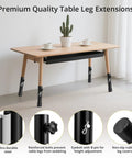Knockout Black Table Leg Extenders And Adjustable Height Risers For Folding Tables on a wooden table with a potted plant.