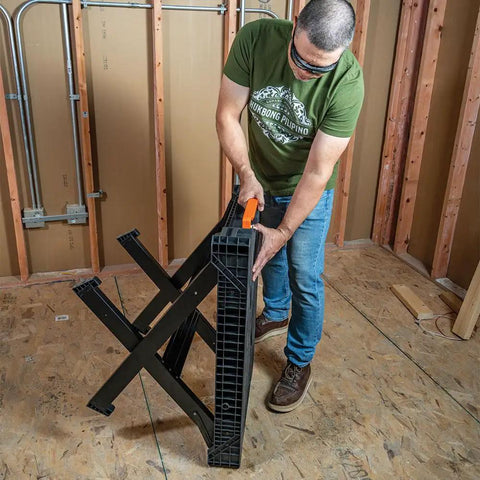 Person setting up MODbox Folding Work Bench On The Go Quick Set Up Heavy Duty 1000 Pound Capacity Portable Work Table in workshop