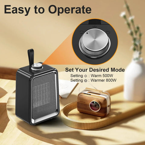 Portable Space Heater 800W 500W Energy Efficient Desk Heater with temperature dial and mode settings on table.
