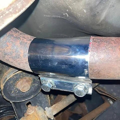 Close-up of Four Pack 2.5 Inch Stainless Steel Butt Joint Exhaust Clamp Band Sleeve installed on exhaust pipe.