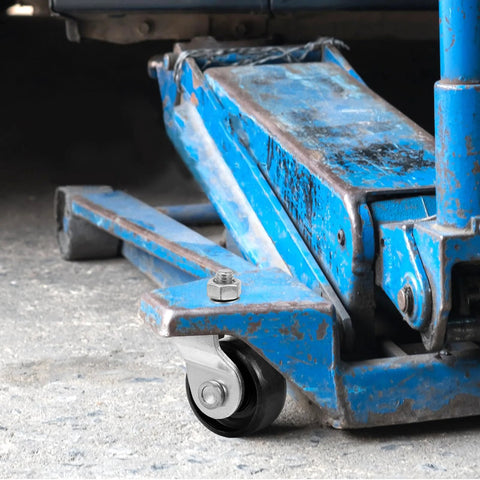 Universal Hydraulic Floor Jack Caster Wheel Replacement 2.75x1.96x1.57 In installed on blue jack in garage setting