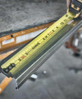 NGT 25 Foot Tape Measure With One And A Quarter Inch Tape for Quick Accurate Measurements on metal framing piece