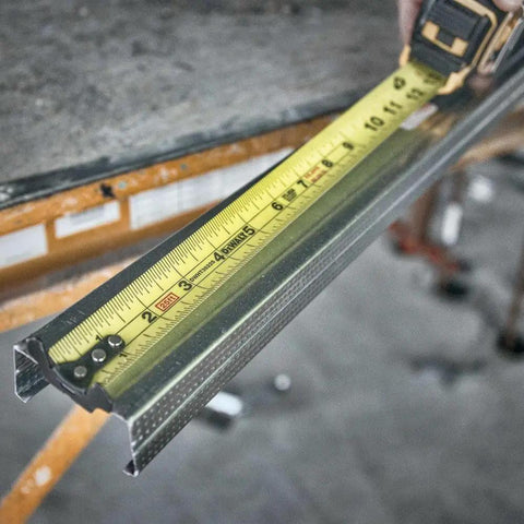 NGT 25 Foot Tape Measure With One And A Quarter Inch Tape for Quick Accurate Measurements on metal framing piece