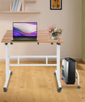 Effortless Folding Standing Desk With Smooth Rolling Casters And Tilted Writing Panels For Total Flex Work From Home Setup Featuring Quick Height Adjustments In Modern Light Walnut And White with a laptop and flowers on the desk.