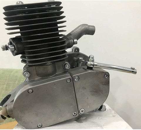Gas engine cylinder for 2-stroke bicycle engine; aluminum-gray with cooling fins, side view showing exhaust bolts.