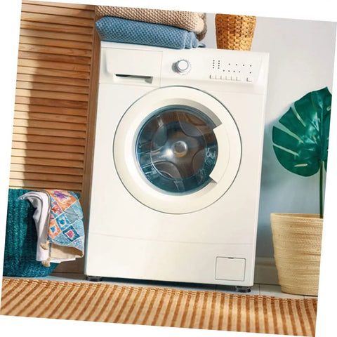 Front view of a white washing machine with 4 Pack Anti Slip Washing Machine Foot Pads With Shock Absorbent Rubber Bases For Noise Reduction.