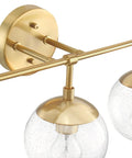Close-up of Gracelyn Satin Gold 3-Light Bathroom Vanity Light with Clear Seedy Glass Globes, modern fixtures