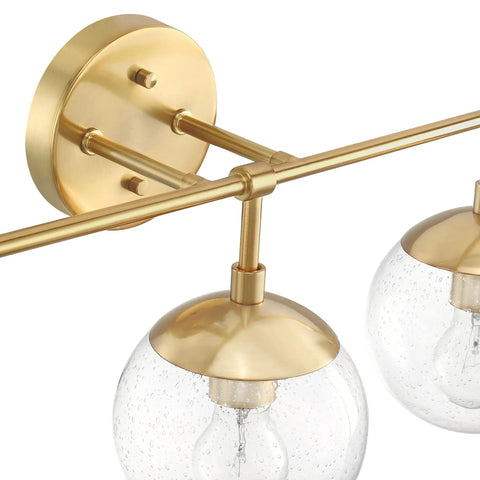 Close-up of Gracelyn Satin Gold 3-Light Bathroom Vanity Light with Clear Seedy Glass Globes, modern fixtures