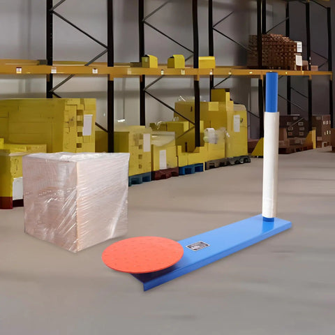 Handheld Manual Stretch Film Pallet Wrapping Dispenser Heavy Duty Packing Machine For Warehouse Logistics No Sweat Setup Handles Big Loads With Ease Supports 132 Lbs Ready To Roll beside wrapped cardboard box in warehouse.