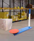 Heavy Duty Manual Stretch Film Wrapping Dispenser With 360 Rotating Pallet Packing Tool next to wrapped cargo in warehouse.