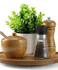 9 Inch Acacia Wood Lazy Susan Turntable Organizer For Cabinets And Pantry Shelves with spice jars and plant