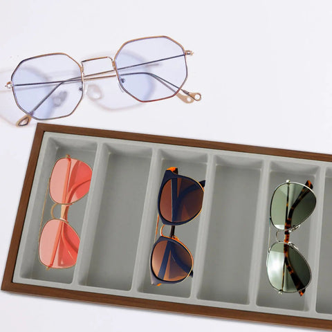 Keep Your Shades Neat In This Slick Wooden Sunglasses Holder Tray Featuring Plush Gray Velvet Lining And Seven Roomy Slots For Secure Eyewear Organization At Home with four pairs in velvet slots.